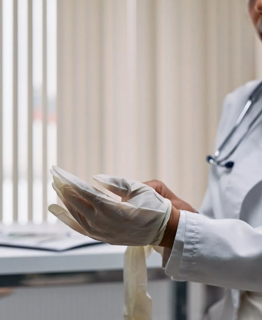 Person having a telehealth video consultation with a licensed clinician on a laptop
